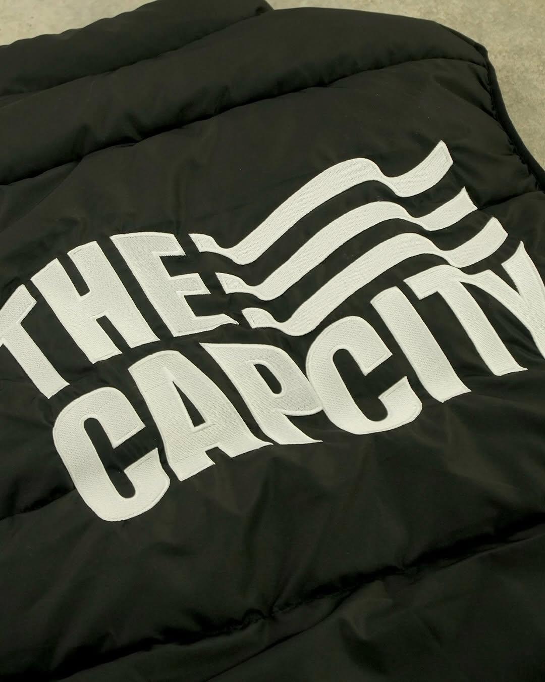 TCC 'WAVING FLAG' PUFFER VEST