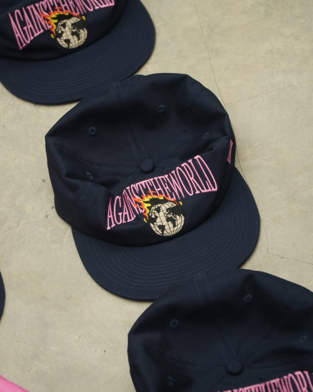 TCC 'AGAINST THE WORLD' RELAXED-FIT CAP COLLECTION